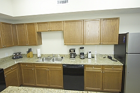 Plenty of work surface showing toaster, knife set, paper towels, coffee maker, blender, can opener